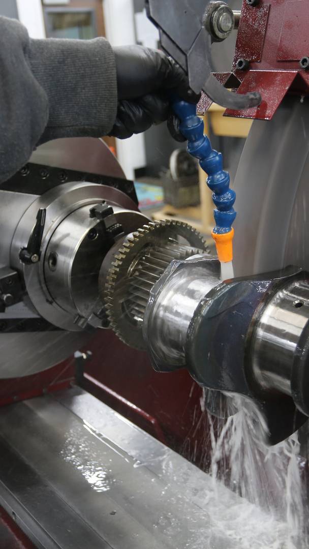 Employee working on an engine