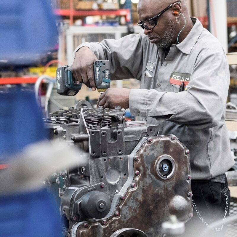 Man working on engine.