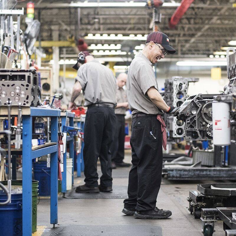 Reviva employees working on engines