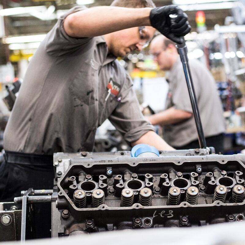 Man working on engine.